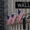 The Wall St sign is picture in front of the New York Stock Exchange (NYSE) in New York City