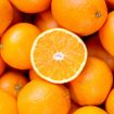 half-of-orange-on-the-heap-of-oranges-royalty-free-image-1598525395